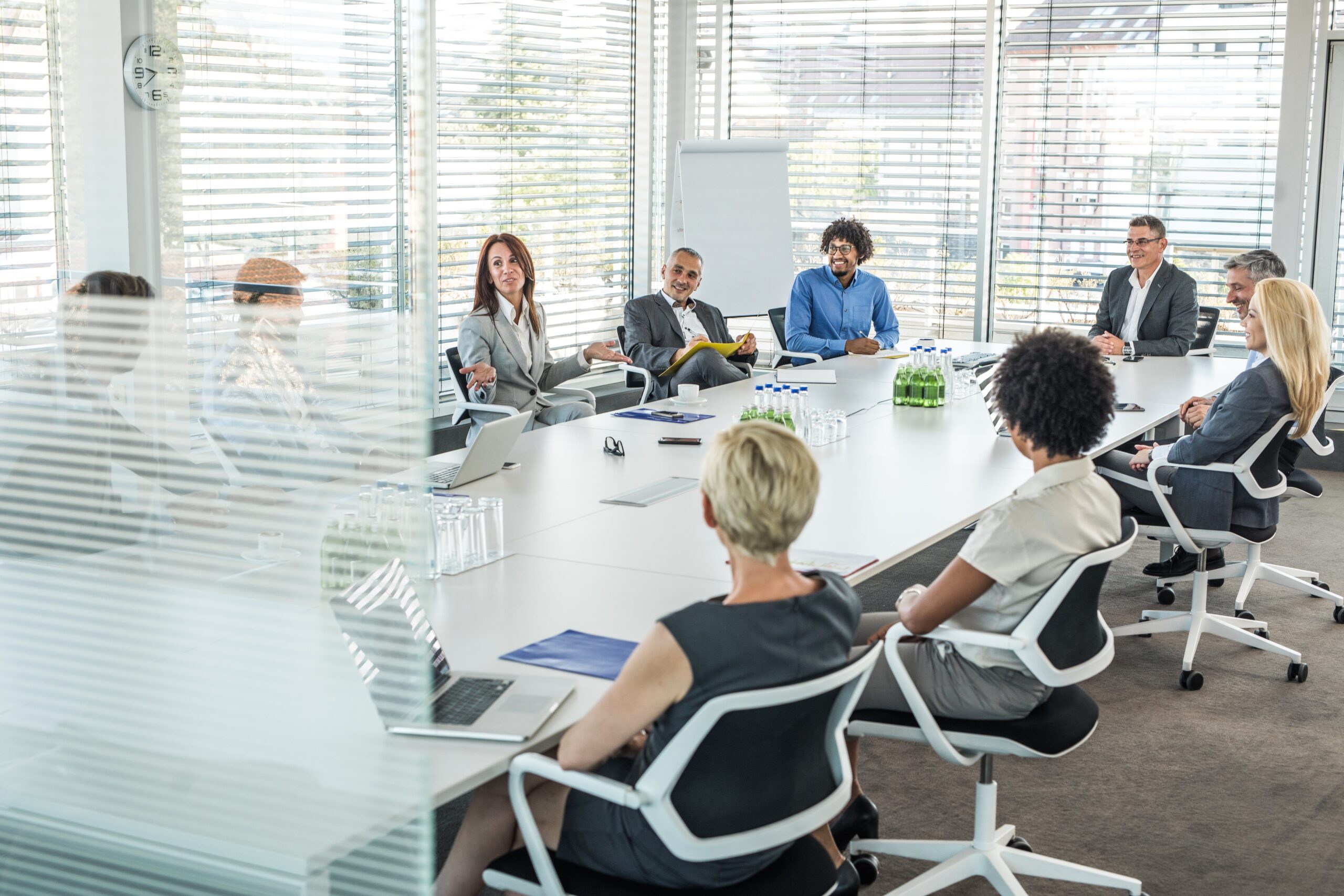 Large group of happy entrepreneurs having a meeting at conference table in the office.