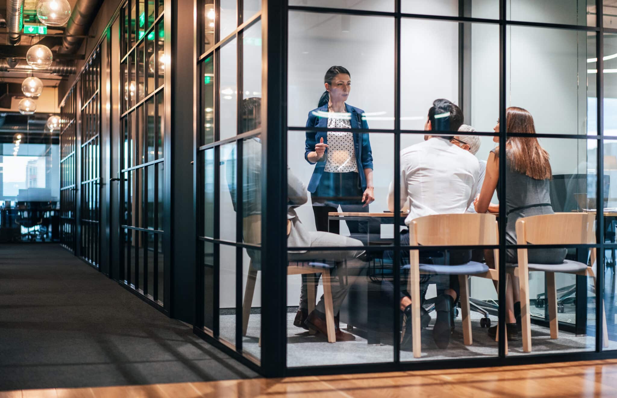 Leadership team in a modern office conference room setting strategic priorities